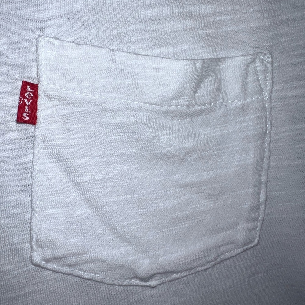 Levi’s white long sleeve top with front pocket